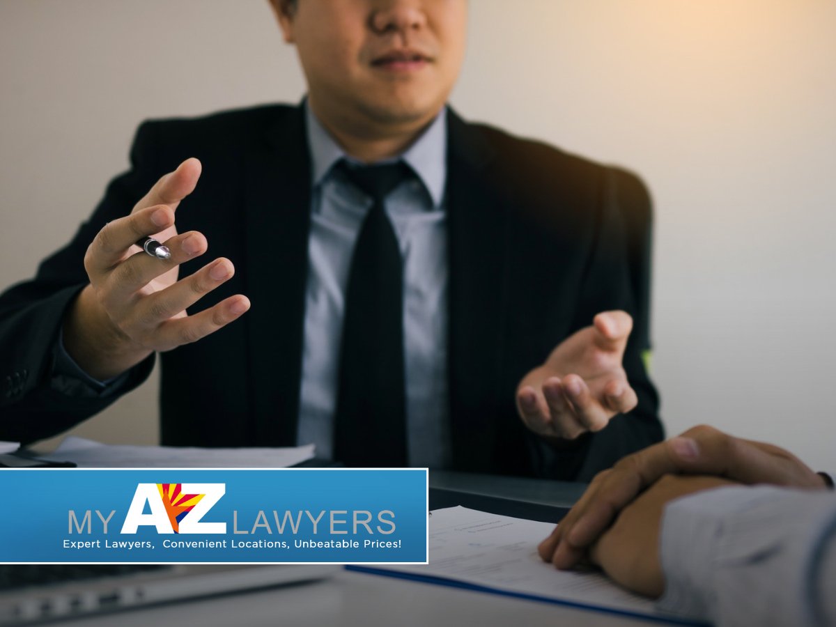 Bankruptcy lawyer explaining debt relief options to a client in Avondale, AZ