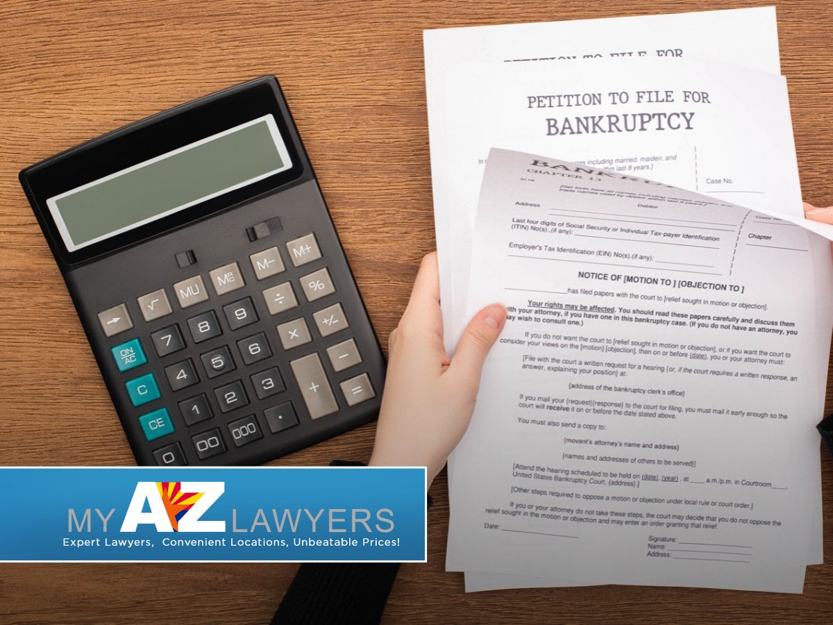 Bankruptcy petition paperwork next to a calculator in Avondale, AZ